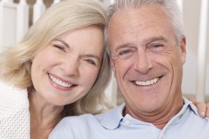 Older Caucasian Couple Smiling and Close Together