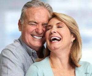 Mature Couple Smiling and Laughing While Hugging